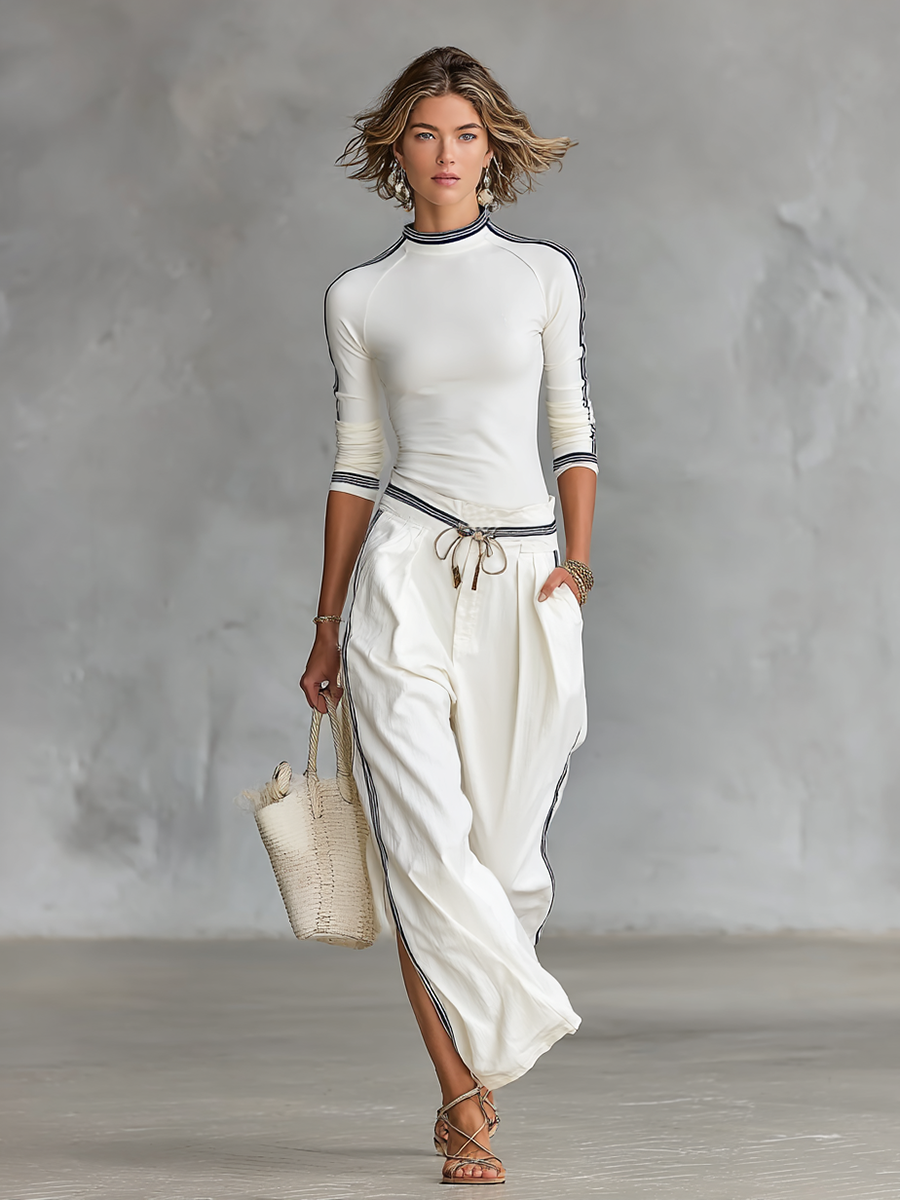 Set due pezzi da donna: T-shirt sportiva a maniche lunghe con collo mezzo alto e pantaloni larghi con cordino
