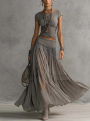 Marianne - Set con top grigio trasparente con inserti in pizzo e gonna lunga plissettata