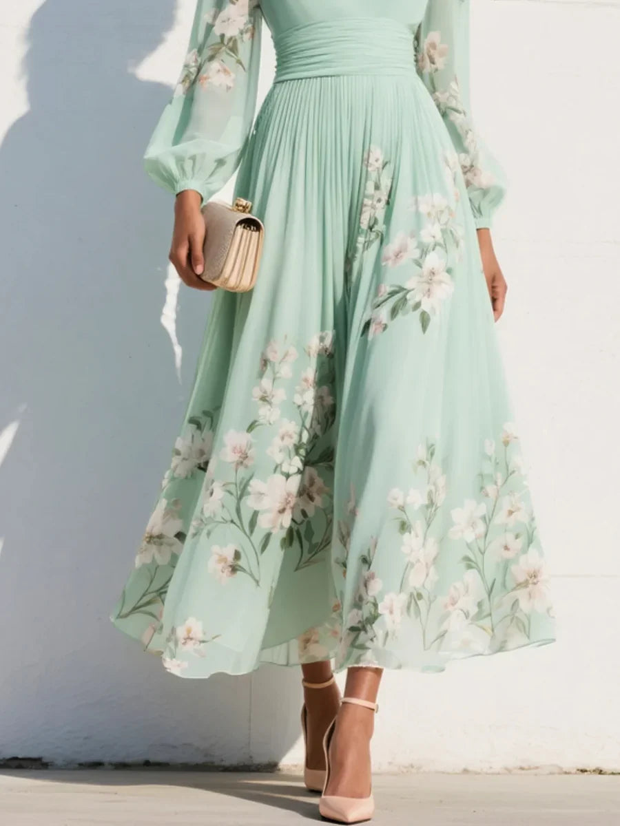 Maxi abito in chiffon plissettato verde menta con motivi floreali