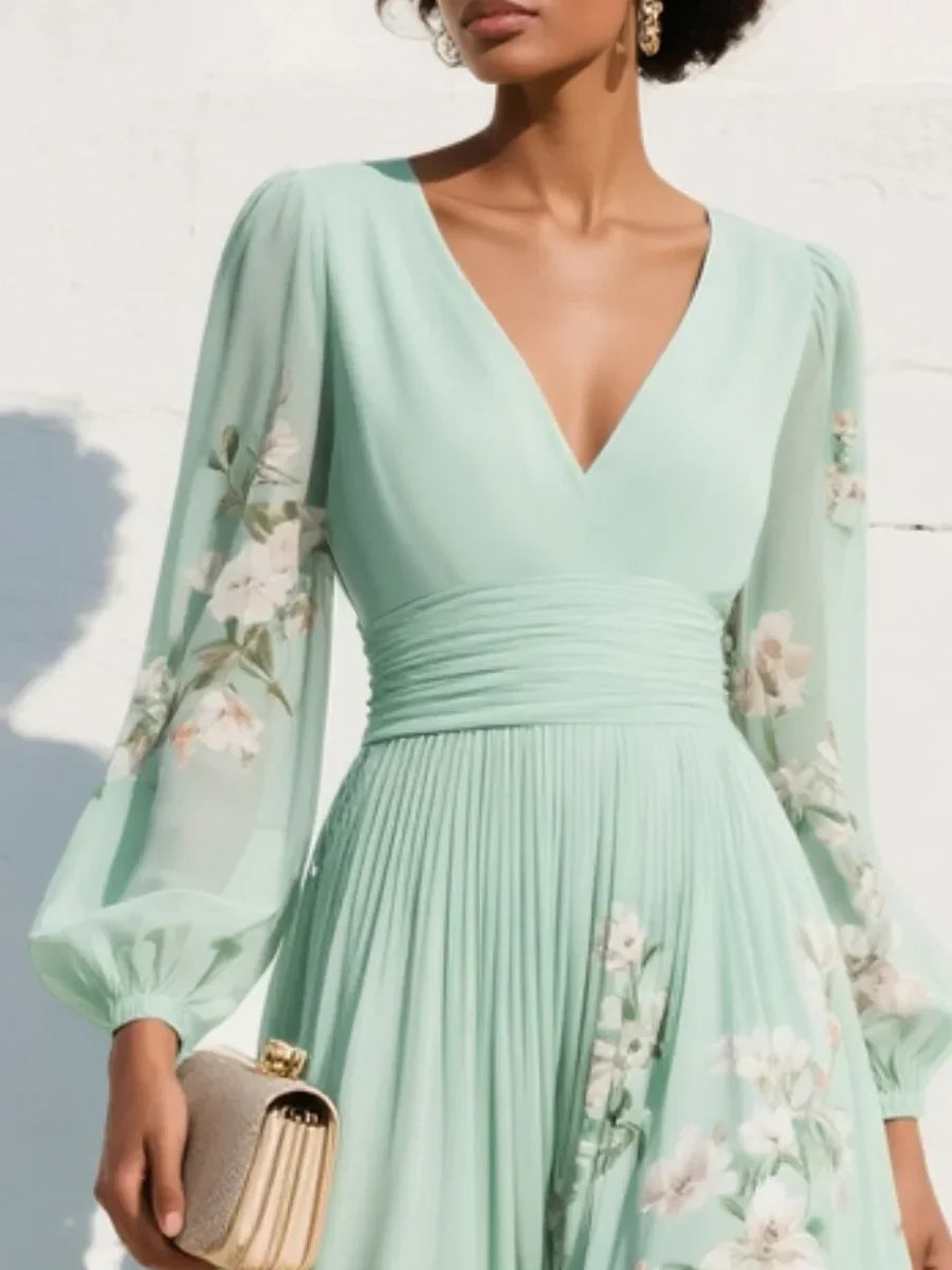 Maxi abito in chiffon plissettato verde menta con motivi floreali