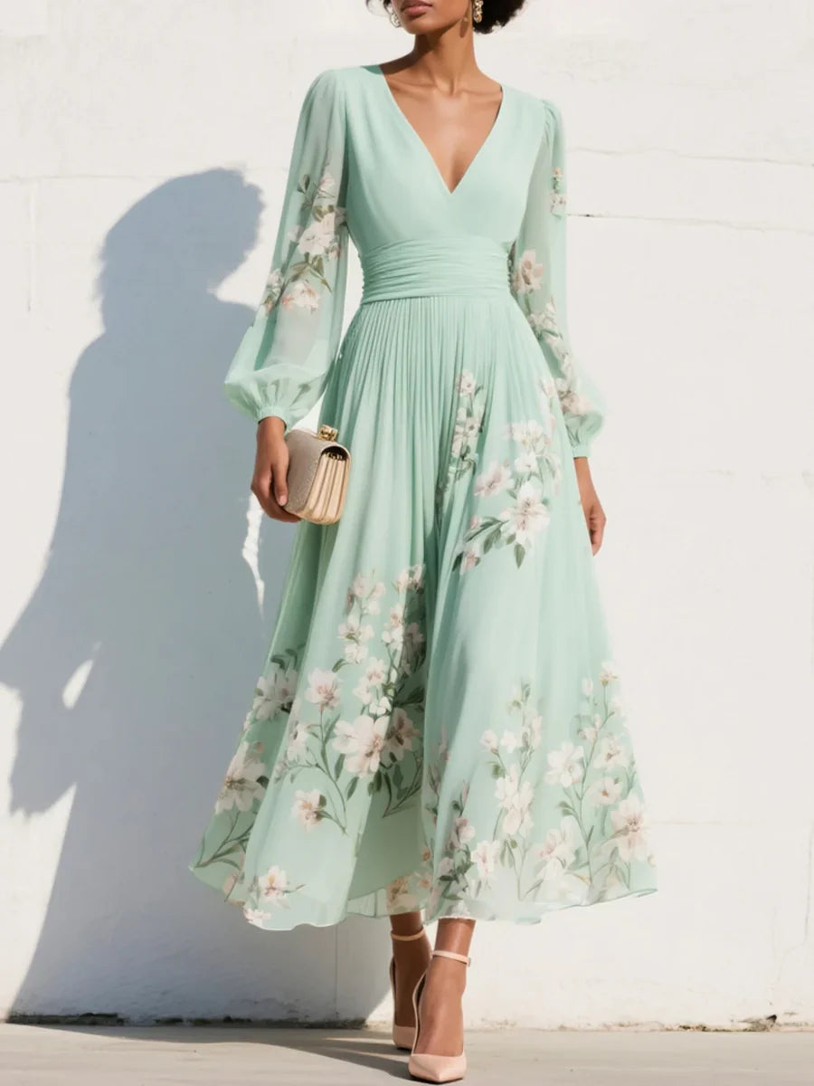 Maxi abito in chiffon plissettato verde menta con motivi floreali